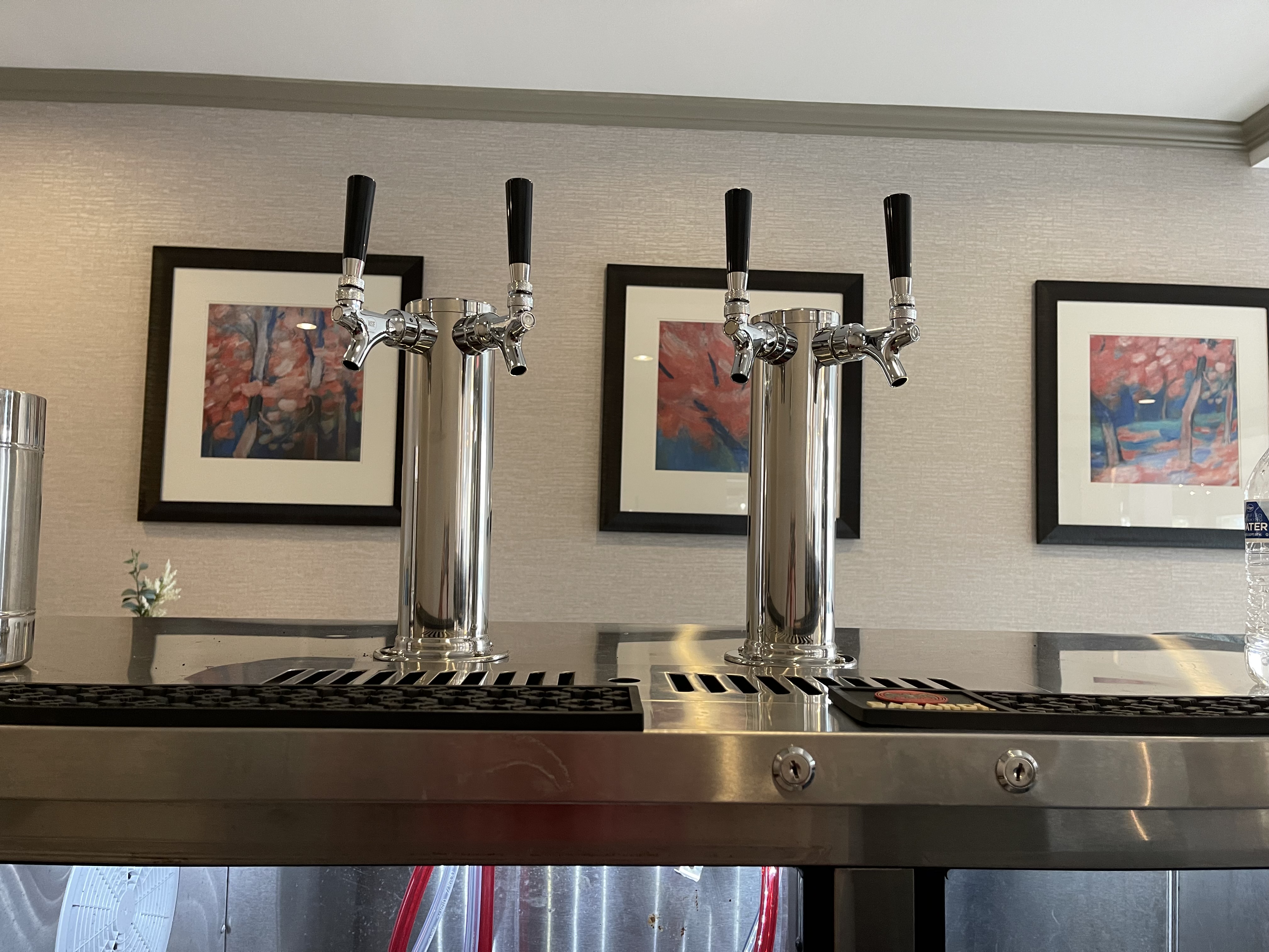 Two polished chrome dual-tap towers in an upscale residential setting