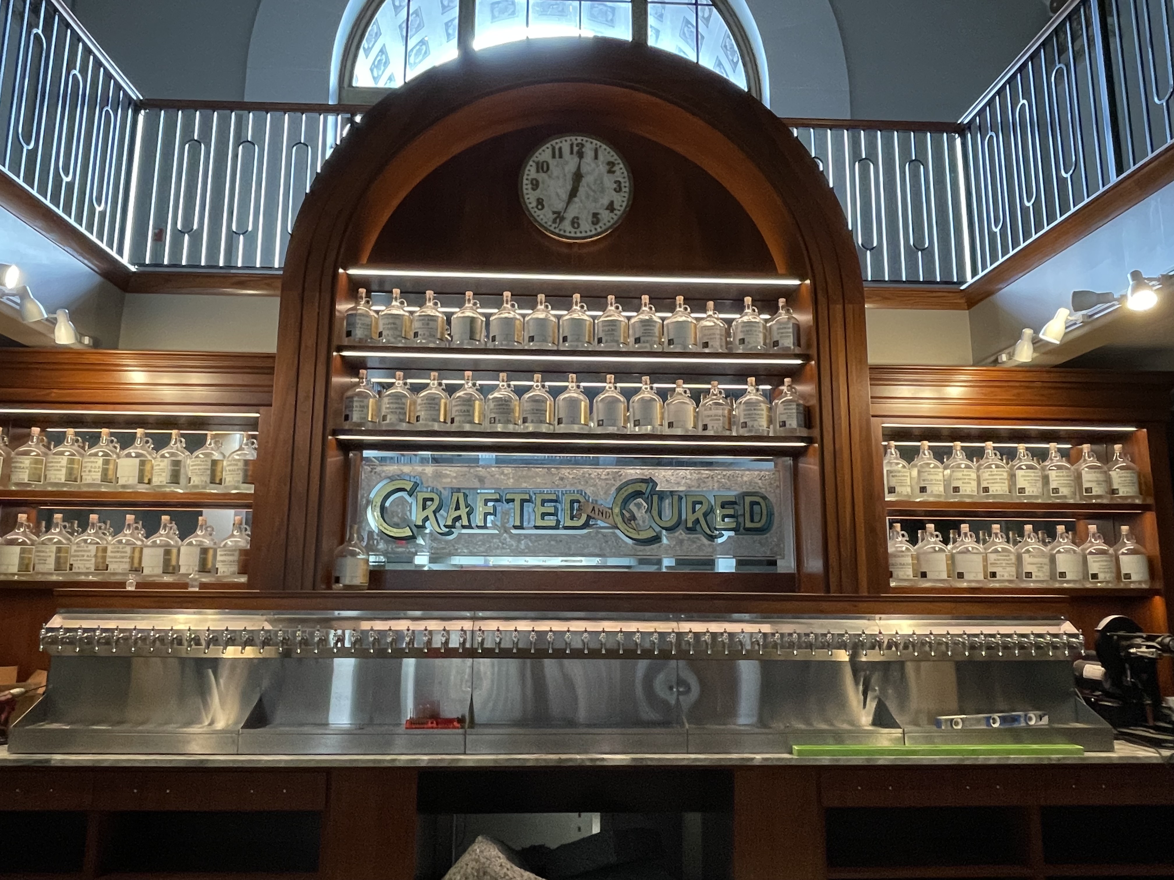 Professional draft beer system installation at Crafted and Cured featuring a massive multi-tap stainless steel rail